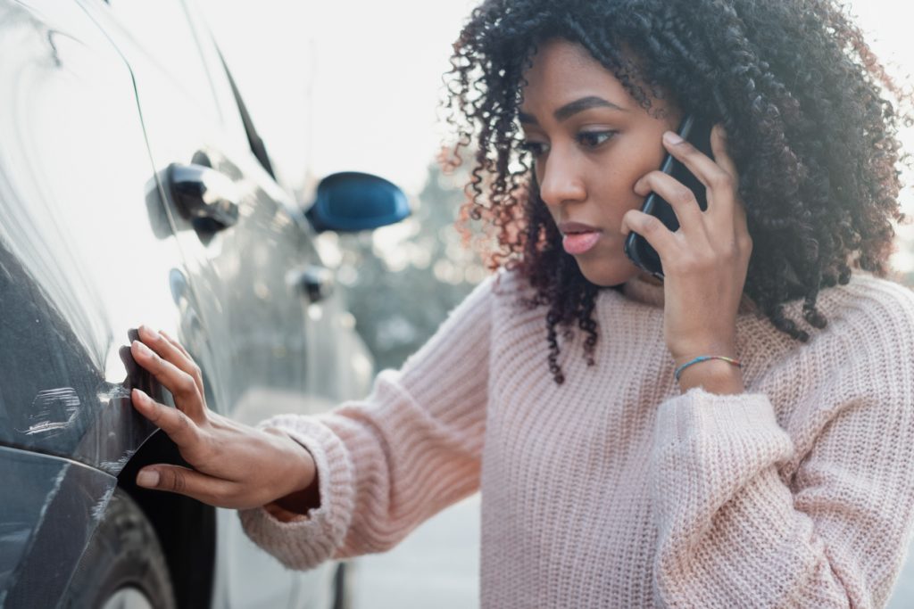 Car accident and black woman calling help